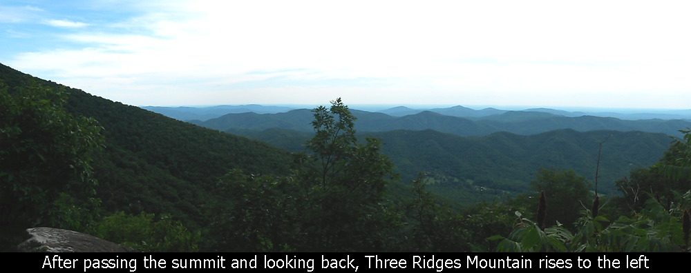 After passing the summit and looking back, Three Ridges Mountain rises to the left
