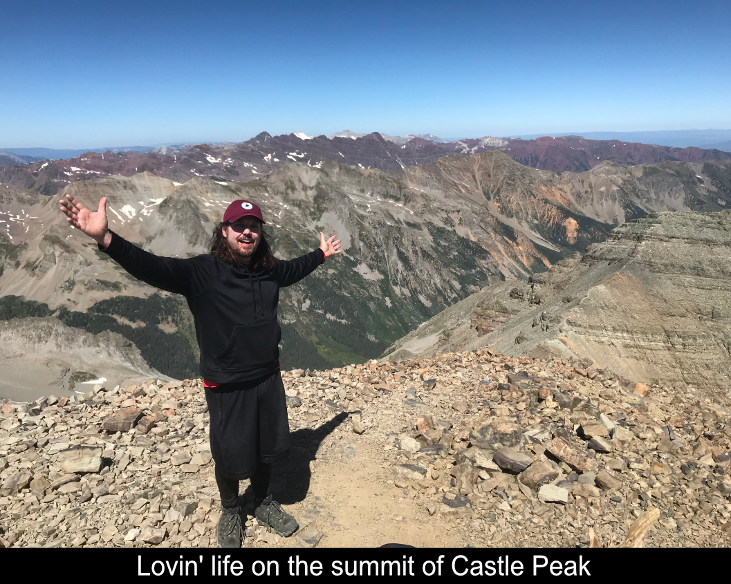 Loving Life On Summit Of Castle Peak