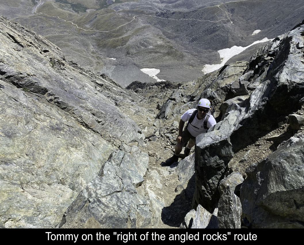 Tommy On The Right Of The Angled Rocks